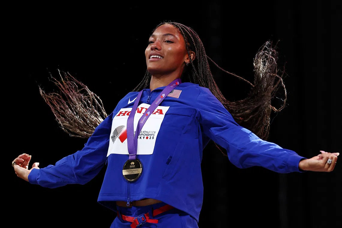 World Athletics Championships Tokyo 2025 - Women's Long Jump Medal Ceremony - Japan National Stadium, Tokyo, Japan - September 15, 2025 Gold medallist Tara Davis-Woodhall of the U.S. celebrates on the podium REUTERS/Eloisa Lopez/File Photo