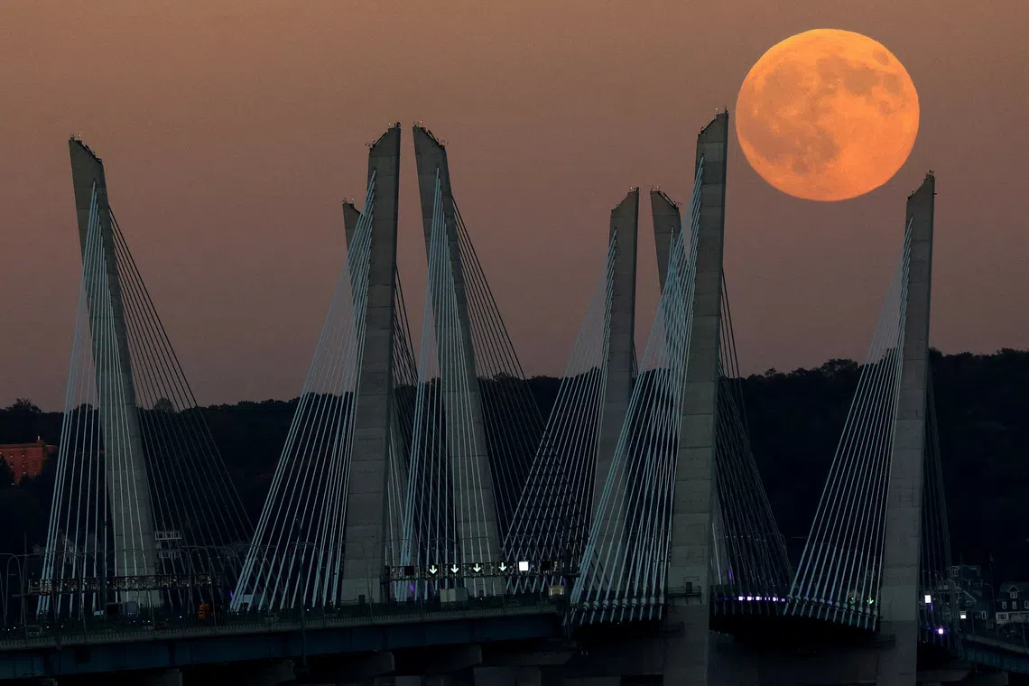 The first Supermoon of the year, known as the Harvest Moon, rising above the Mario Cuomo Bridge spanning the Hudson River as seen from Grandview, New York, U.S., on Oct 6, 2025. 