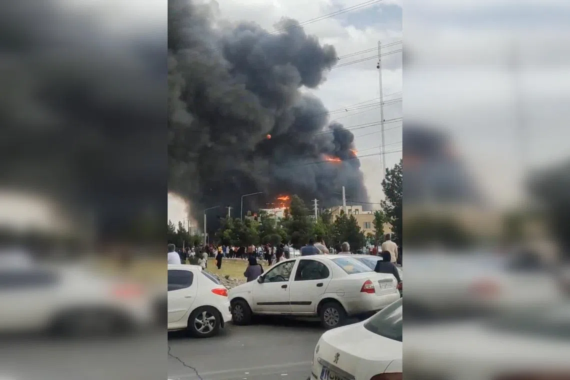 A screen grab from a video posted online shows flames and smoke rising from a  shopping centre in Tehran on May 5.