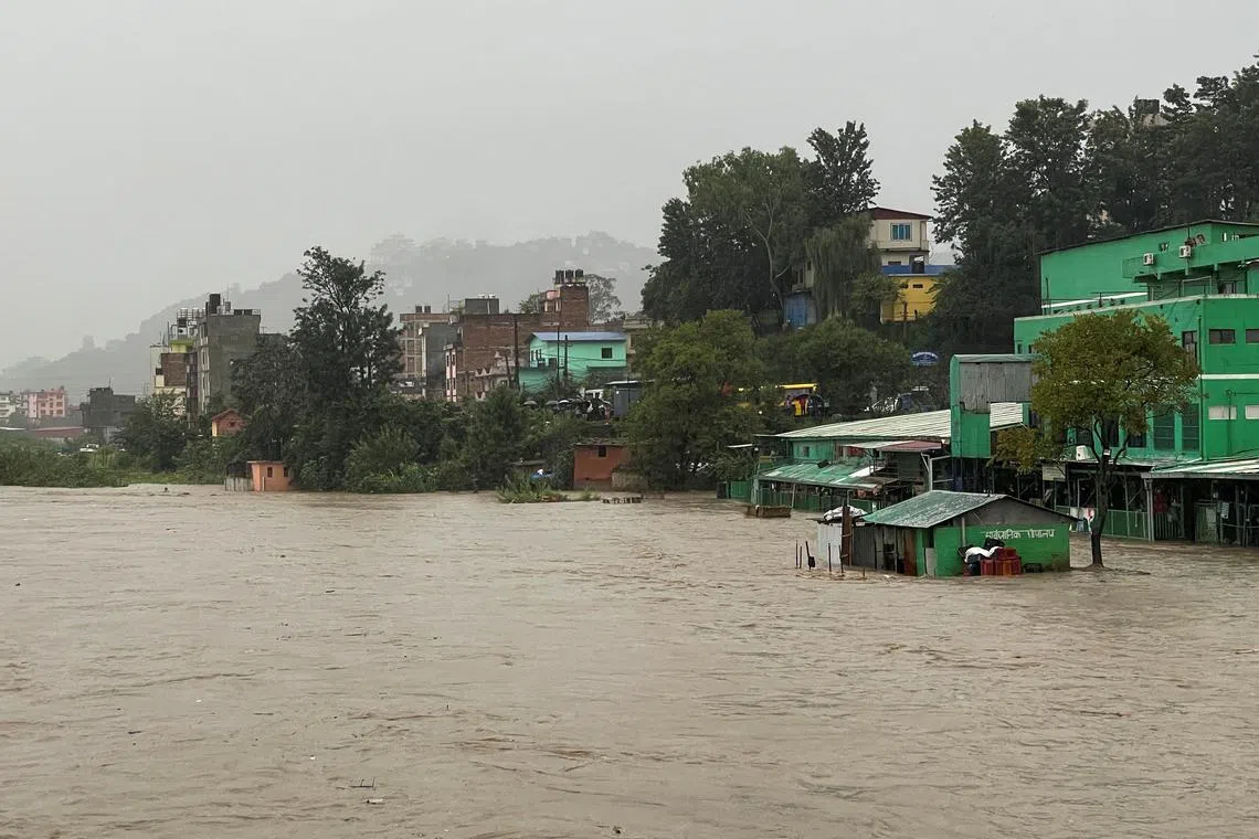 A general view of the overflowing Bagmati River following heavy rains, in Kathmandu, Nepal September 27, 2024. REUTERS/Navesh Chitrakar