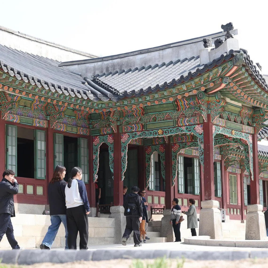 Visitors tour Changdeok Palace, a Joseon Dynasty royal palace, in Seoul, South Korea, March 24, 2026.