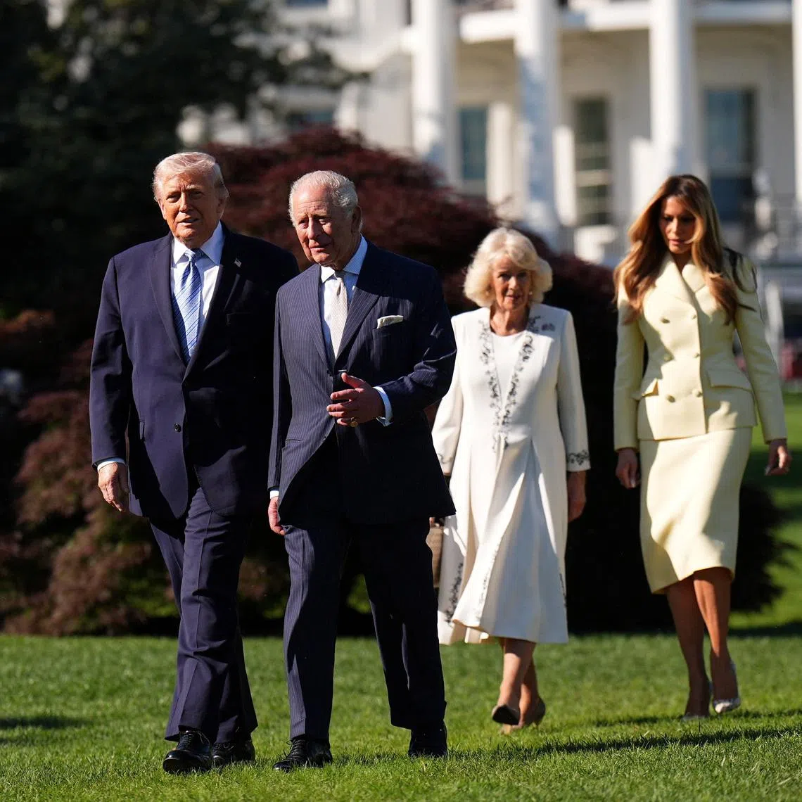 Britain's King Charles and Queen Camilla walk as they join US President Donald Trump and US First Lady Melania for a tour of the White House beehives in the grounds of the White House, on day one of the state visit to the US, in Washington D.C., U.S.,  April 27, 2026.    Aaron Chown/Pool via REUTERS