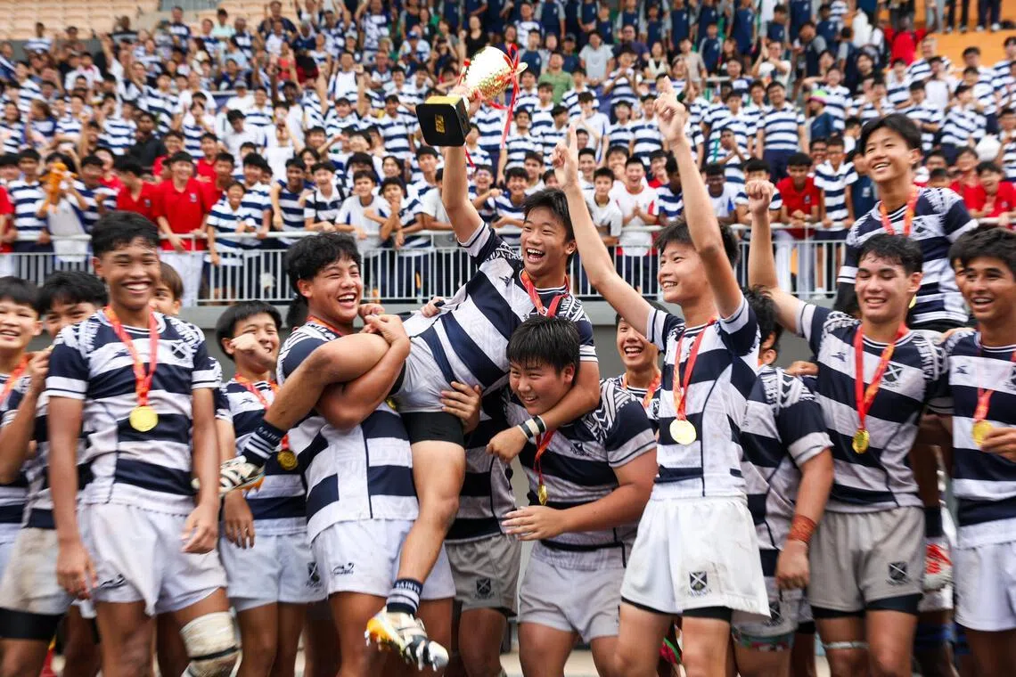 St Andrew's Secondary School rugby players lifting their captain Joshua Kee after winning the National School Games B Division Rugby Finals at Jurong West Stadium on April 1, 2026.