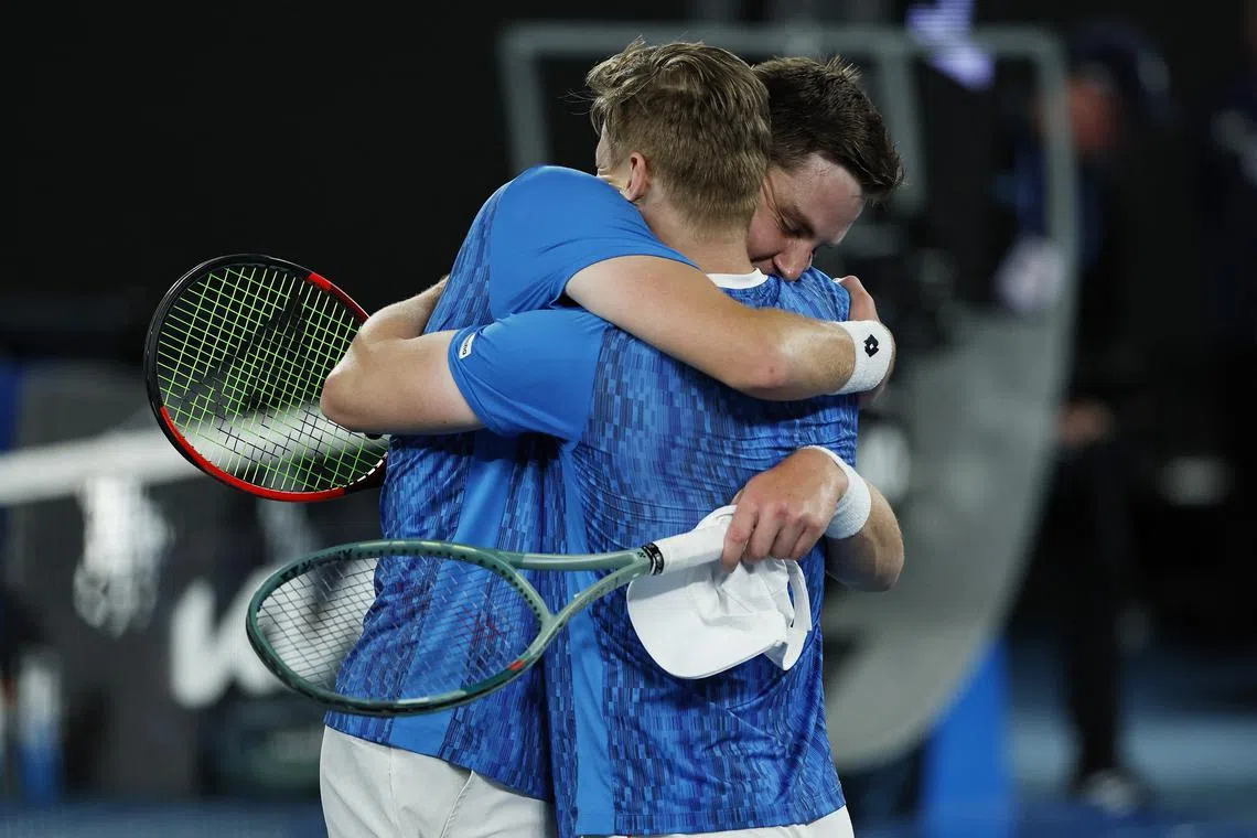 Tennis - Australian Open - Melbourne Park, Melbourne, Australia - January 26, 2025 Finland's Harri Heliovaara and Britain's Henry Patten celebrate after winning their men's doubles final match against Italy's Andrea Vavassori and Simone Bolelli REUTERS/Tingshu Wang