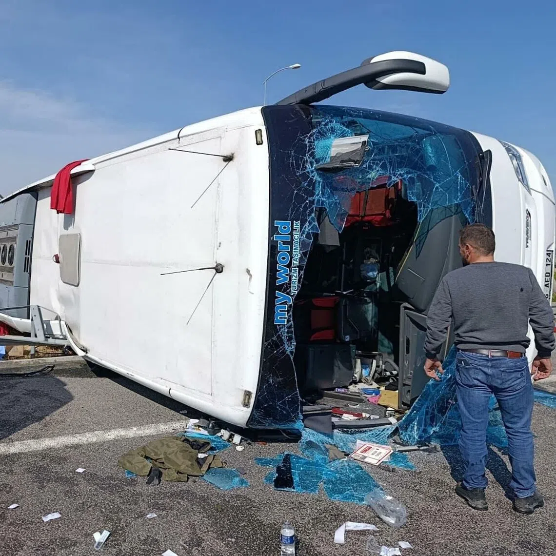 Fire department and first aid officials operating at the site, where a coach collided with a truck on Oct 11, in Manisa, west of Turkey.