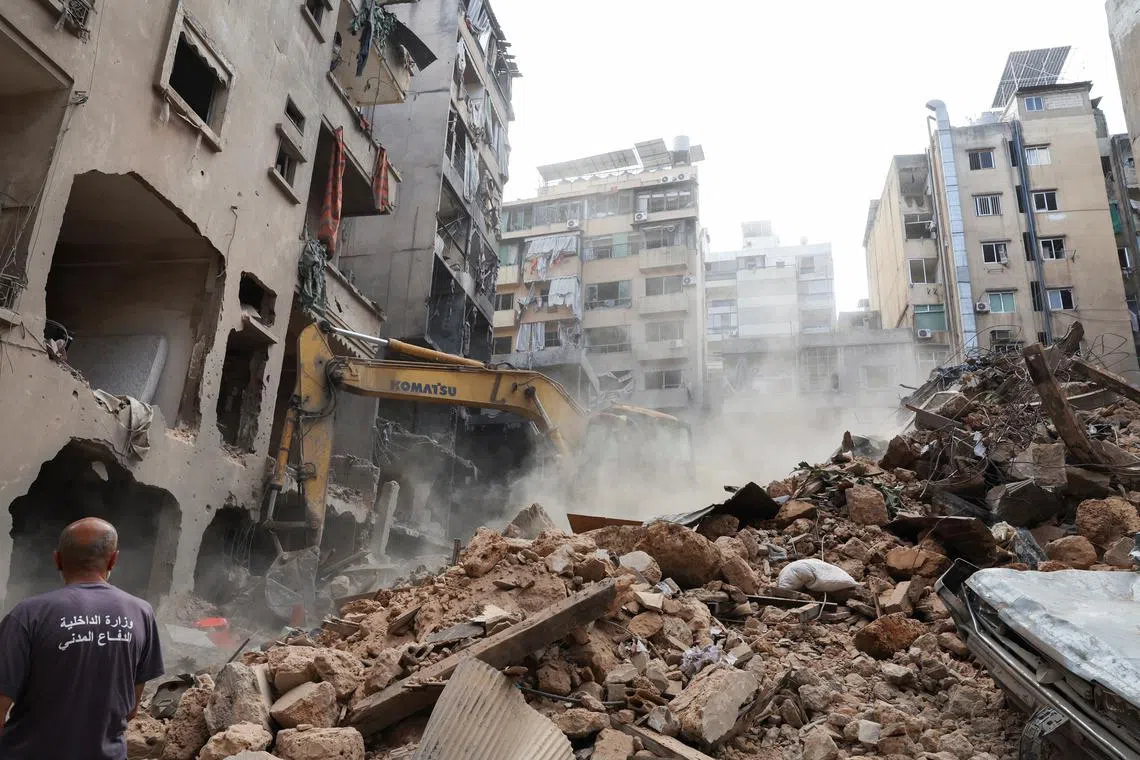 A machinery clears rubble at a site of an Israeli strike, amid ongoing hostilities between Hezbollah and Israeli forces, in Beirut, Lebanon, October 12, 2024. REUTERS/Emilie Madi/File Photo