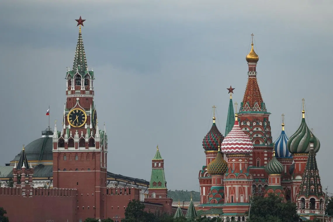 A view of Kremlin's Spasskaya tower and St. Basil's Cathedral, during a stormy weather in Moscow, Russia July 14, 2025.  REUTERS/Evgenia Novozhenina