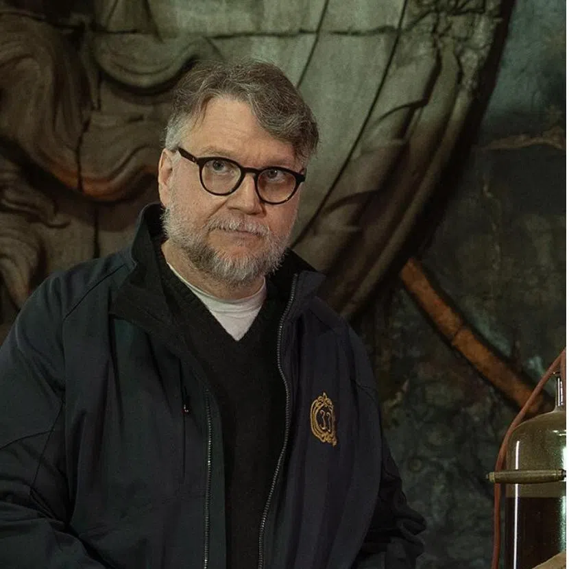 Hungarian-British author David Szalay (left) with his book, Flesh, and Frankenstein director Guillermo del Toro. 
