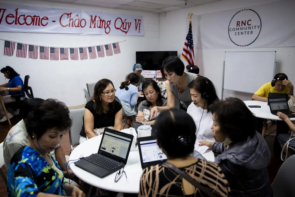 Volunteers making calls on behalf of Ms Michelle Steel in August. Advocates say that Asian American voters can decide elections if they turn out in large enough numbers.
