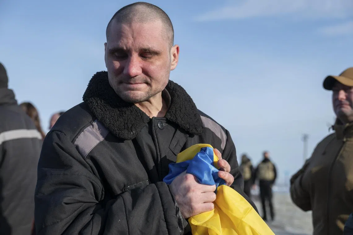 Ukrainian prisoners of war reach Ukraine-controlled territory at an undisclosed location, amid a prisoner swop with Russia.