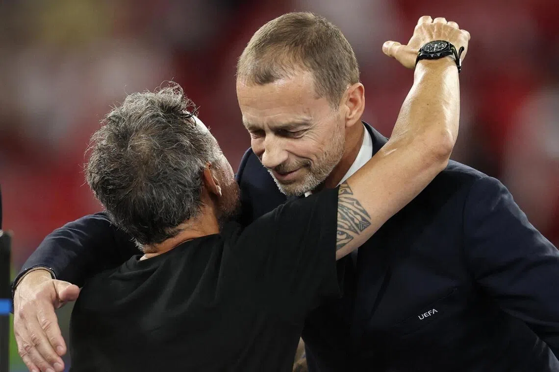 UEFA president Aleksander Ceferin (right) embracing Paris Saint-Germain coach Luis Enrique after the Champions League final win over Arsenal at the Puskas Arena in Budapest on May 30, 2026.