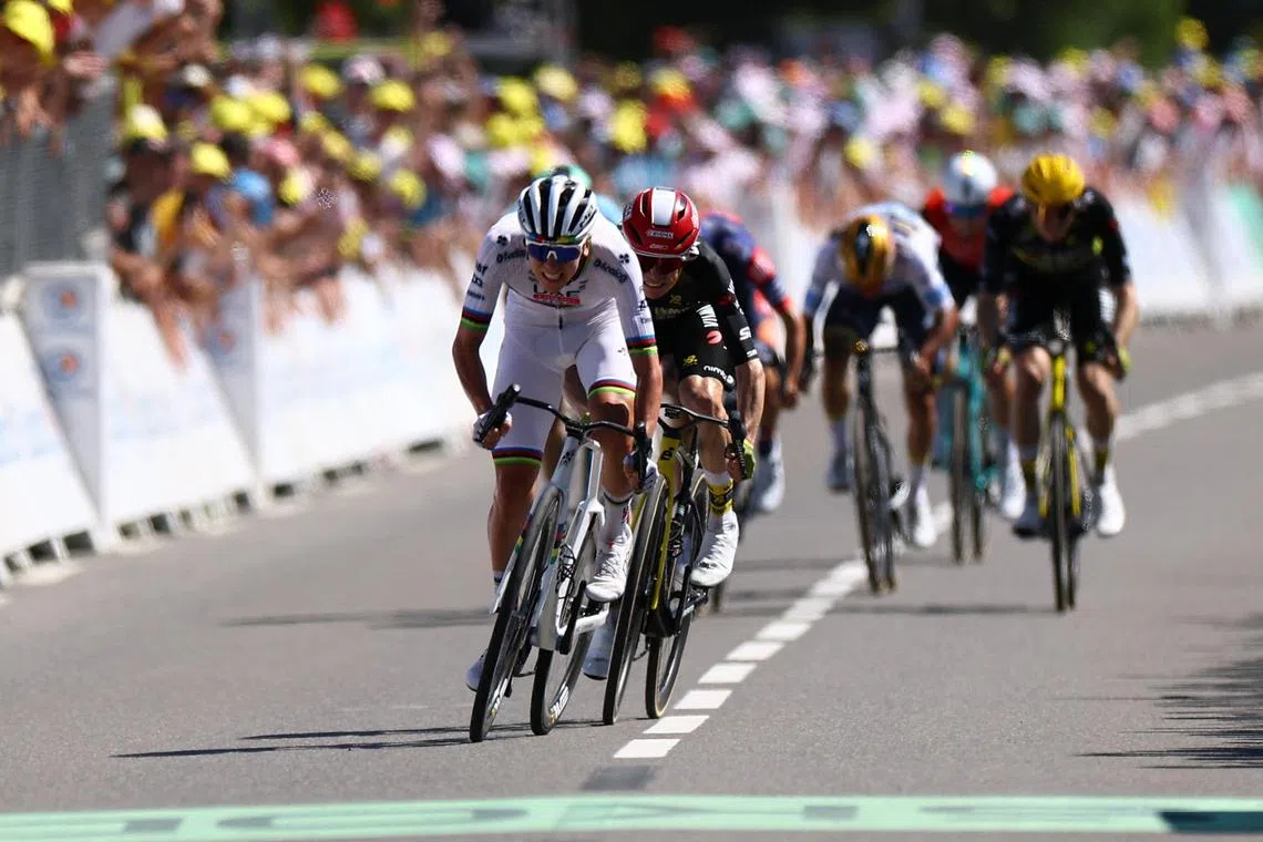 UAE Team Emirates' Tadej Pogacar en route to winning Stage 7 of the Tour de France on July 11.