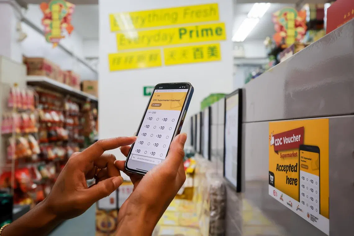 Stickers with CDC voucher logo at a supermarket in Jalan Besar, Jan 3, 2024. The Community Development Council (CDC) Vouchers Scheme 2024 was launched by Mr Lawrence Wong, Deputy Prime Minister and Minister for Finance at Jalan Besar Community Club, together with Mayors Ms Low Yen Ling, Minister of State for Culture, Community and Youth & Trade and Industry, Chairman of Mayors’ Committee and Mayor of South West District; Ms Denise Phua Lay Peng, Mayor of Central Singapore District; Mr Desmond Choo, Mayor of North East District; Mr Alex Yam, Mayor of North West District; and Mr Fahmi Aliman, Mayor of South East District.