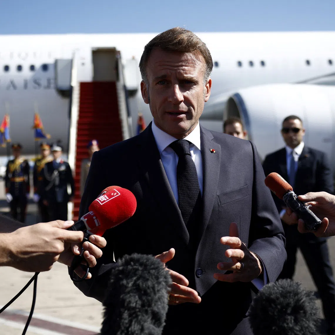 French President Emmanuel Macron speaks to the members of the media, after arriving by plane to attend the Gaza Peace Summit, in Sharm el-Sheikh, Egypt, October 13, 2025. Yoan Valat/Pool via REUTERS