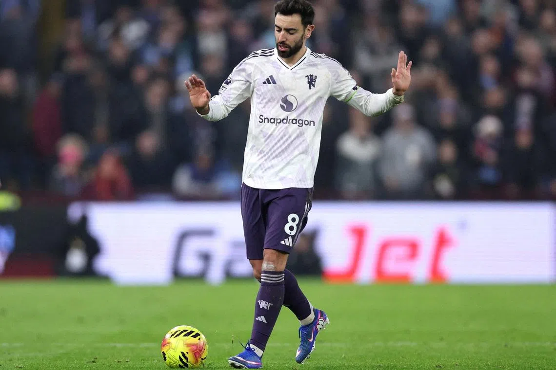FILE PHOTO: Soccer Football - Premier League - Aston Villa v Manchester United - Villa Park, Birmingham, Britain - December 21, 2025 Manchester United's Bruno Fernandes reacts after sustaining an injury REUTERS/David Klein/File Photo