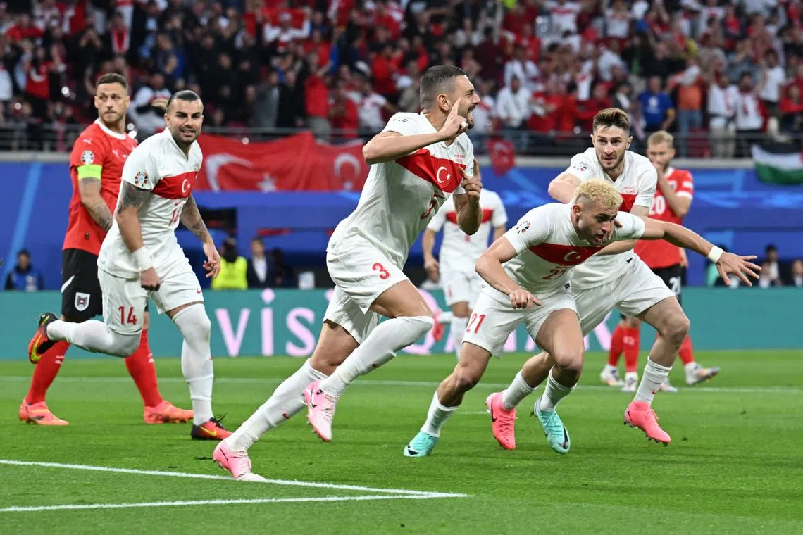 Soccer Football - Euro 2024 - Round of 16 - Austria v Turkey - Leipzig Stadium, Leipzig, Germany - July 2, 2024 Turkey's Merih Demiral celebrates scoring their first goal with teammates REUTERS/Annegret Hilse