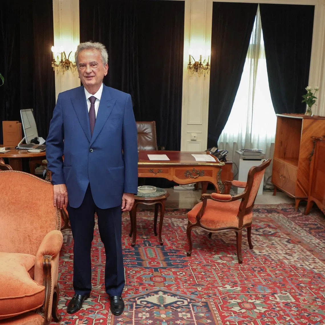 FILE PHOTO: Longtime chief of Lebanon's Central Bank Riad Salameh, poses as he leaves office after a 30-year tenure, at Lebanon's Central Bank building in Beirut, Lebanon July 31, 2023. REUTERS/Mohamed Azakir/ File Photo