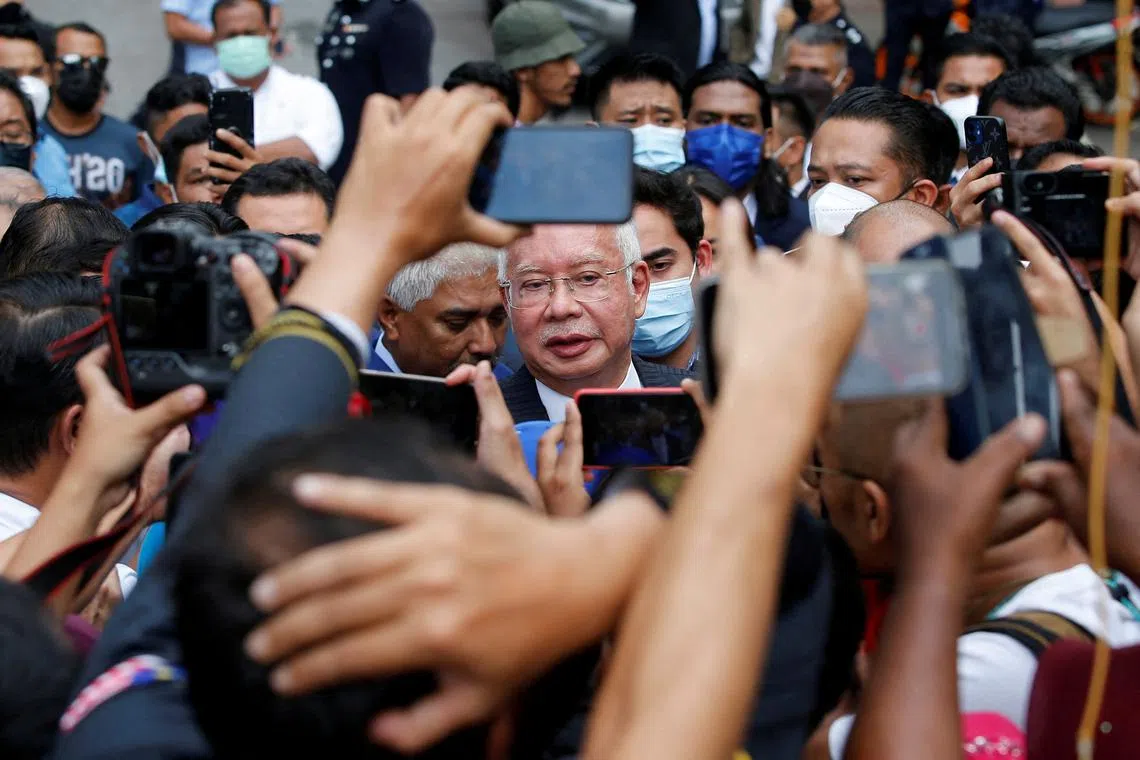 FILE PHOTO: Former Malaysian Prime Minister Najib Razak speaks to journalists outside the Federal Court during a court break, in Putrajaya, Malaysia August 23, 2022. REUTERS/Lai Seng Sin/File Photo