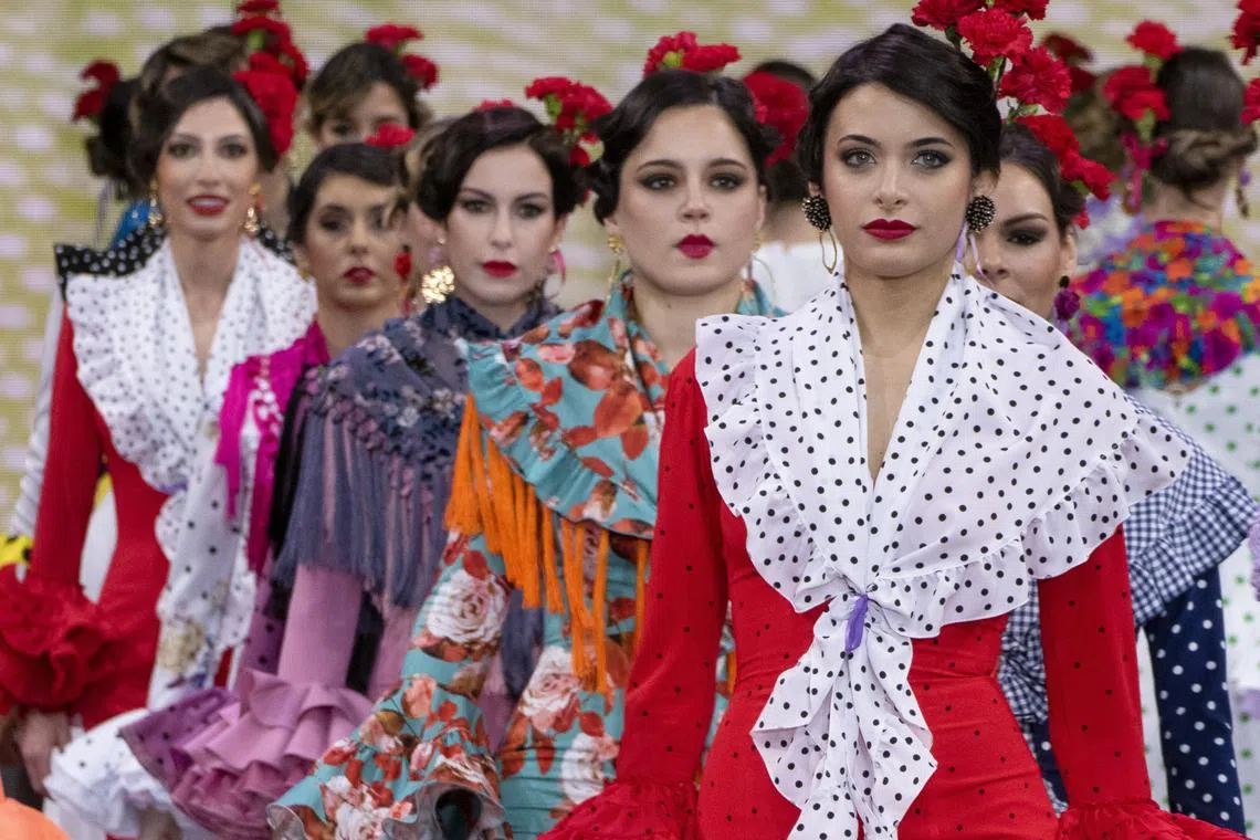 Models present creations by Yolanda Moda Flamenca fashion design at the closing event of the International Flamenco Fashion Show SIMOF 2023 in Seville, Andalusia, southern Spain, Jan 29, 2023.  