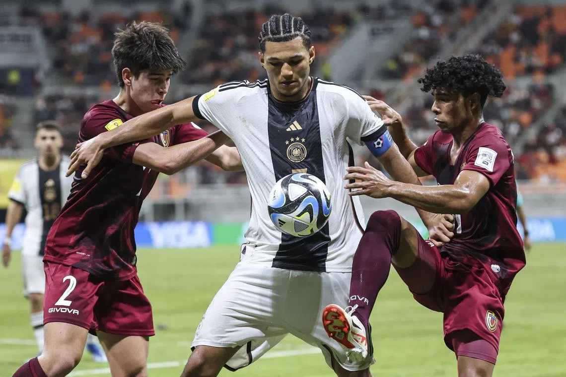 Germany's Paris Brunner (centre) was one of four young players targeted with racist abuse, after a photo of them was posted online by the German football association.