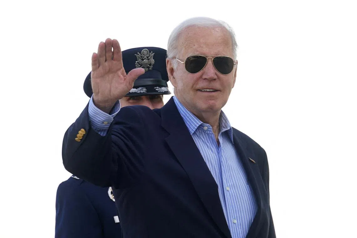 U.S. President Joe Biden waves as he boards Air Force One upon his departure for the G7 summit in Italy, from Joint Base Andrews in Maryland, U.S., June 12, 2024.  REUTERS/Kevin Lamarque