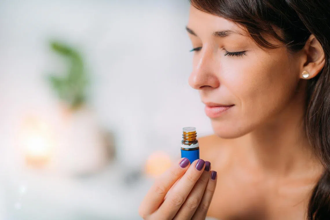 anscent12 - Holding and Smelling Ayurvedic Oil