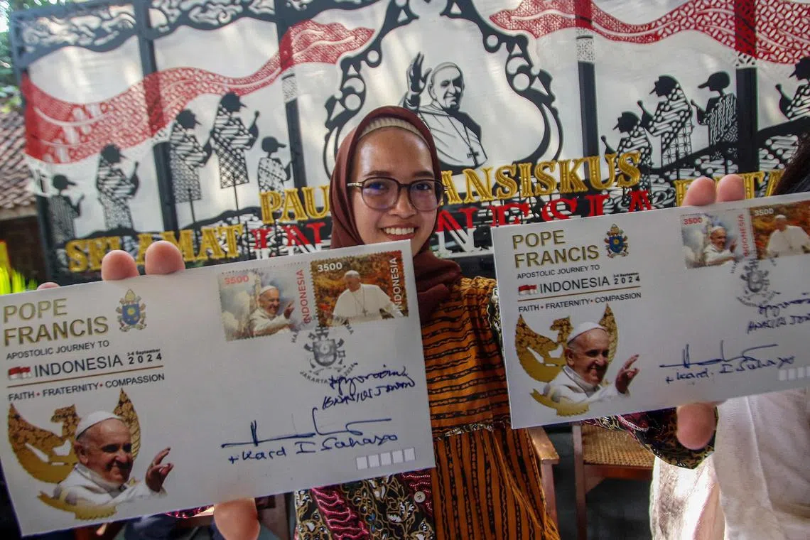 Samples of a new series of stamps ahead of the visit by Pope Francis during the launch ceremony at the Jakarta Cathedral in Jakarta on Sept 2, 2024. 