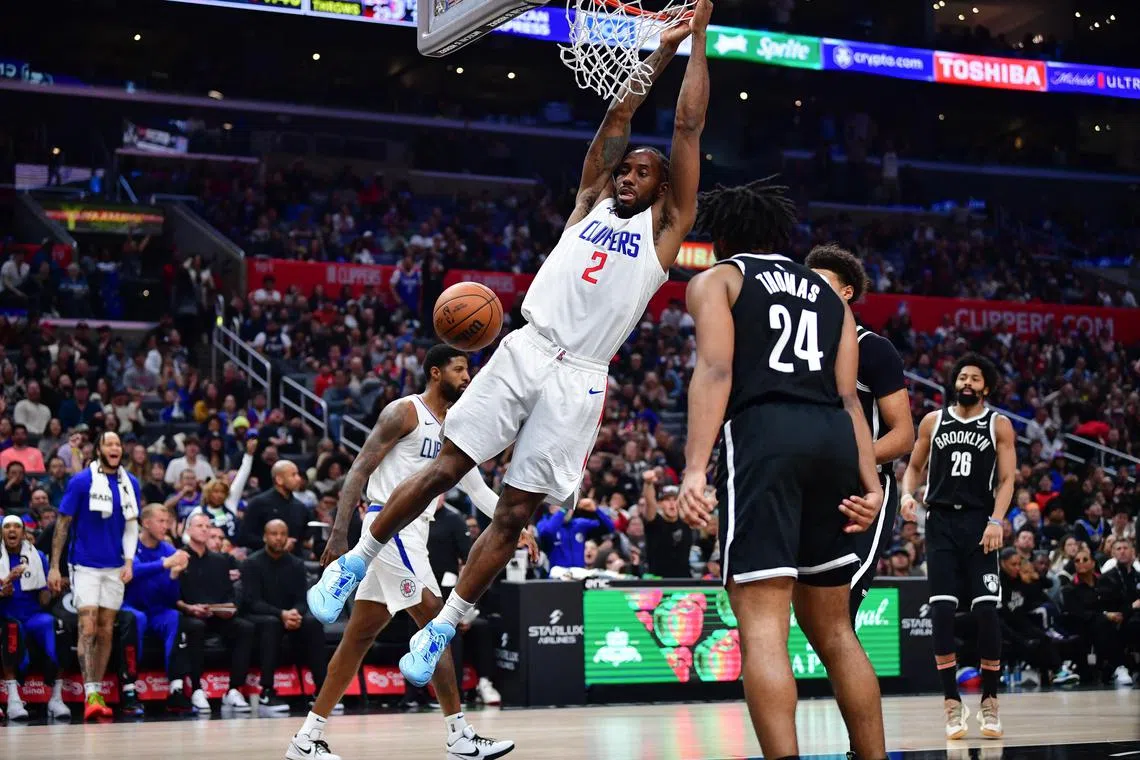 Los Angeles Clippers forward Kawhi Leonard dunking the ball against the Brooklyn Nets during the second half at Crypto.com Arena on Jan 21. He scored 14 of his 21 points in a late run that saw the Clippers win 125-114.