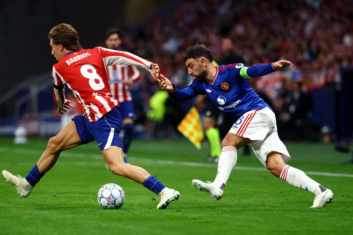 Manchester United’s Bruno Fernandes in action with Atletico Madrid’s Pablo Barrios during their UEFA Champions League match on Oct 13.