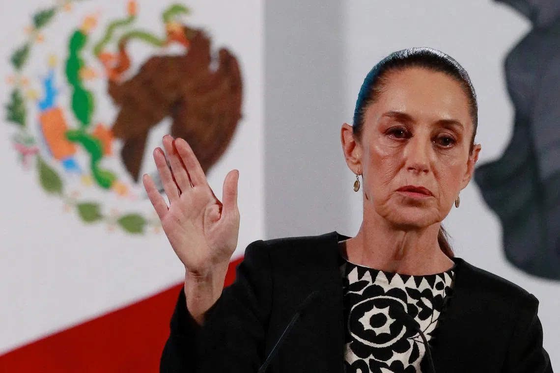 FILE PHOTO: Mexico's President Claudia Sheinbaum gestures as she speaks about U.S. President Donald Trump's policies during a press conference at the National Palace, in Mexico City, Mexico, January 21, 2025. REUTERS/Henry Romero/File Photo