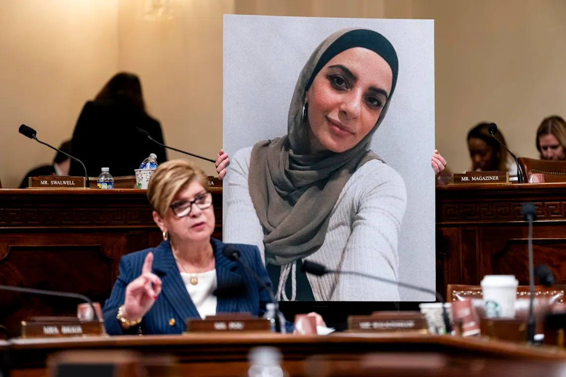 US Represnative Nellie Pou speaking as an aide holds a photo of Leqaa Kordia during a House Homeland Security Committee hearing on Feb 10.