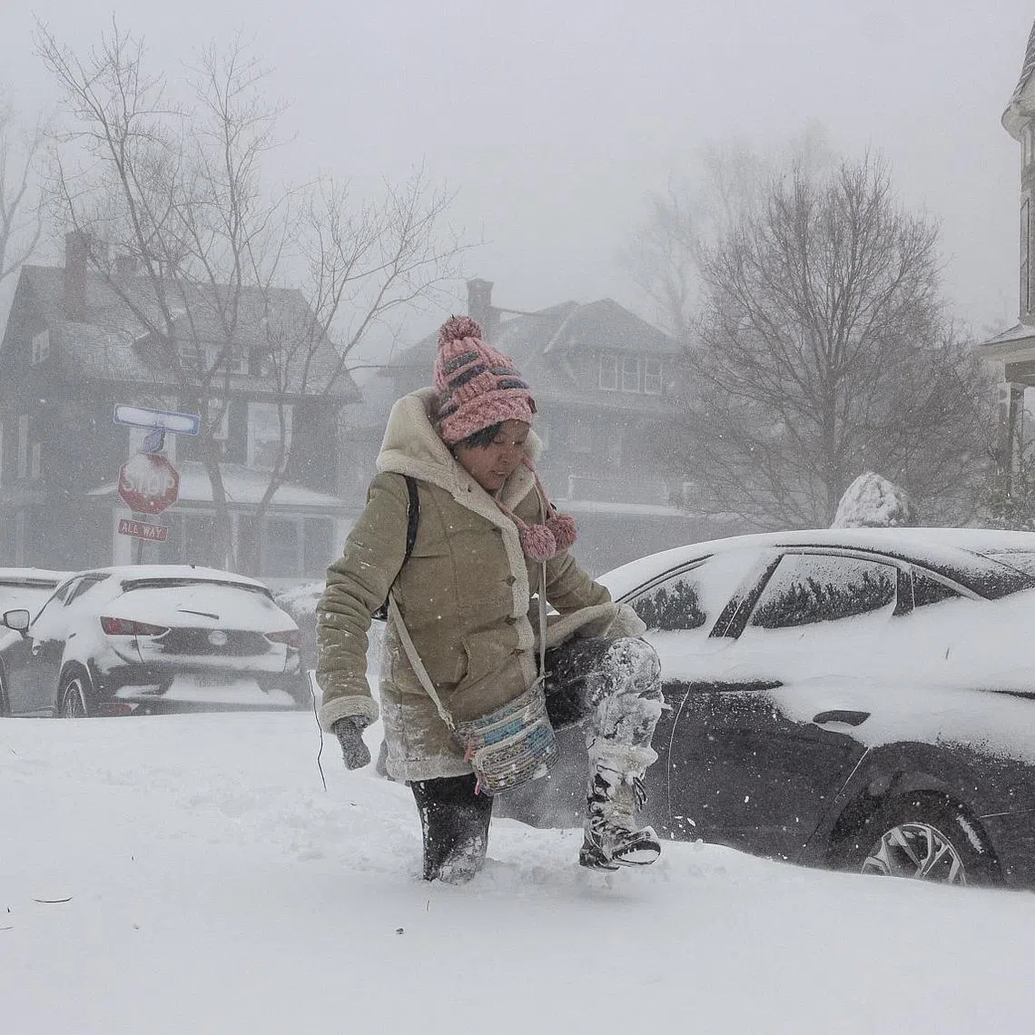 A resident navigating deep snow amid a large winter storm, in Buffalo, New York, on Dec 24, 2022.