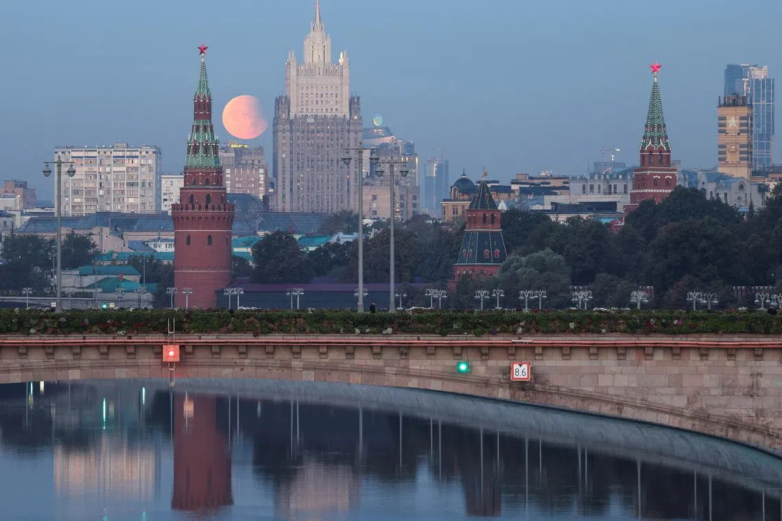 FILE PHOTO: Partial lunar eclipse is seen with the Kremlin and Russia's Foreign Ministry headquarters building in the foreground, in Moscow, Russia, September 18, 2024. REUTERS/Marina Lystseva/File photo