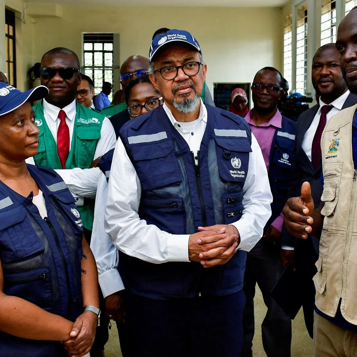 Director-General of the World Health Organisation (WHO) Tedros Adhanom Ghebreyesus, talks to Ugandan medical workers during his visit at the Mulago National Referral Hospital Isolation Unit, as aid agencies intensify efforts to contain a new Ebola outbreak involving the Bundibugyo Virus, in Mulago suburb, of Kampala, Uganda June 8, 2026. REUTERS/ Abubaker Lubowa