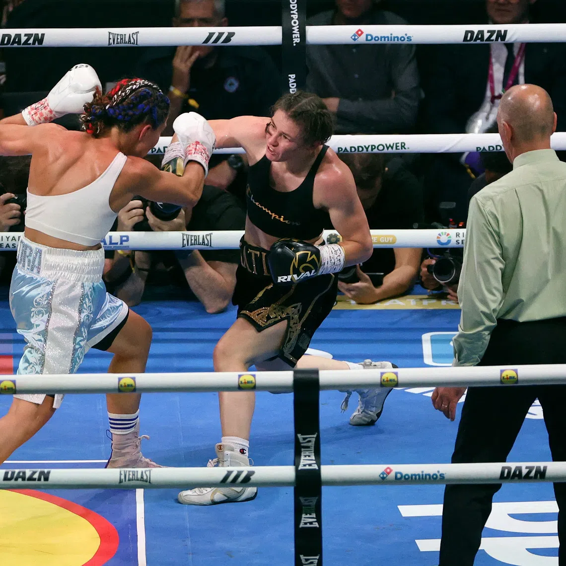 Katie Taylor (in black) en route to a unanimous decision win over France’s Flora Pili on Sept 5.