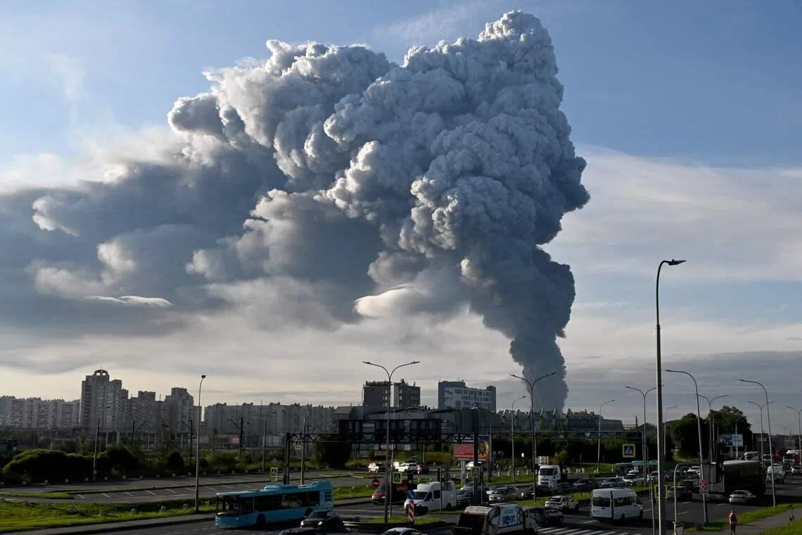 Smoke rises from a warehouse for a Russian e-commerce giant near Saint Petersburg after being hit by Ukrainian drones early on July 24.
