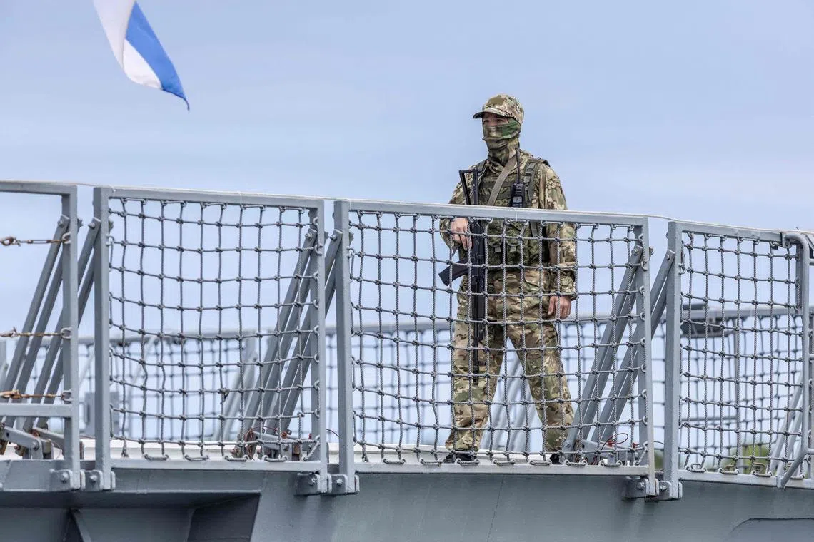 A member of the Russian military aboard the frigate Admiral Gorshkov, during Russia's military drills with China and South Africa in February 2023.