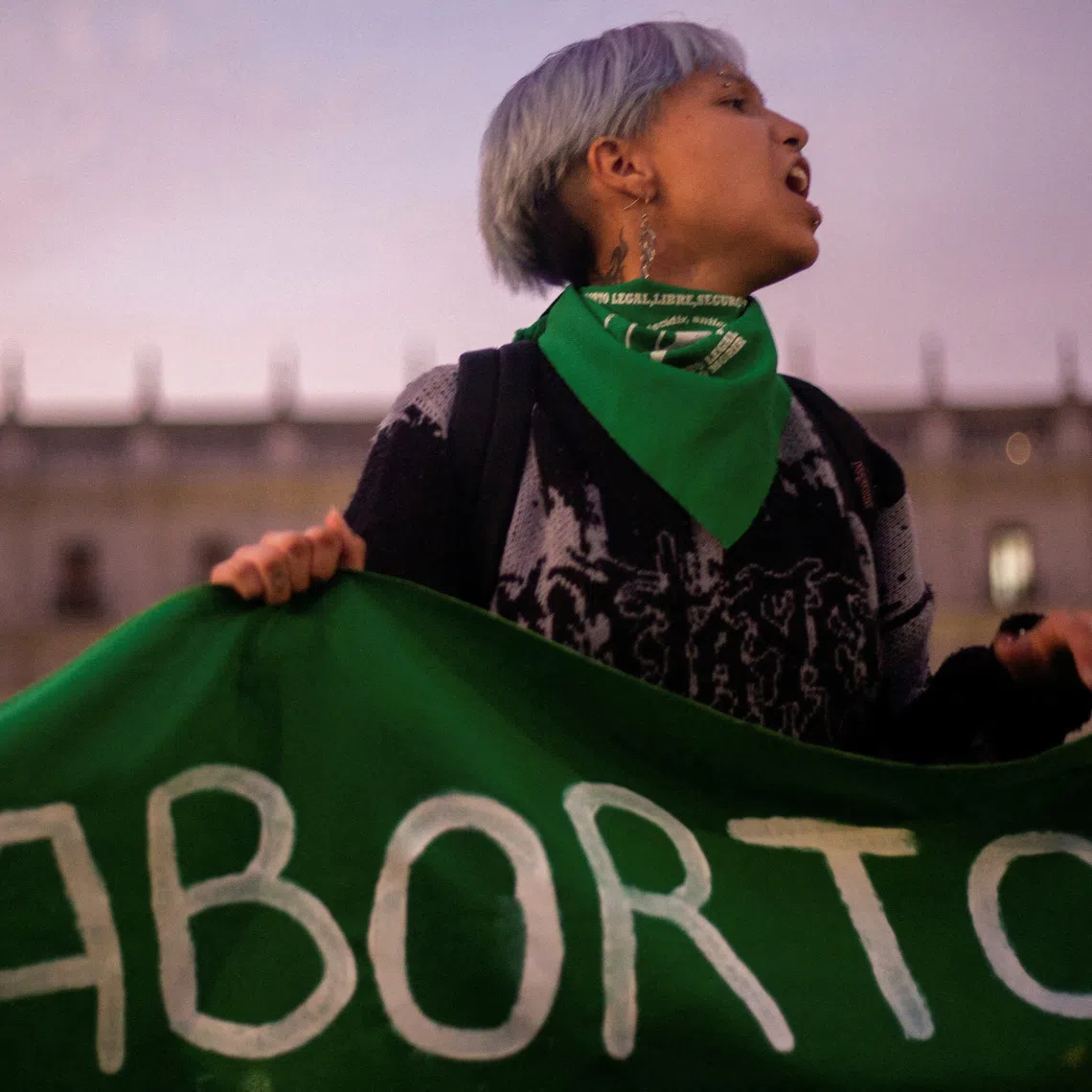 FILE PHOTO: A demonstrator holds a banner in a rally to mark International Safe Abortion Day, in front of La Moneda government palace, in Santiago, Chile, September 28, 2023. REUTERS/Quetzalli Nicte-Ha/File Photo/File Photo
