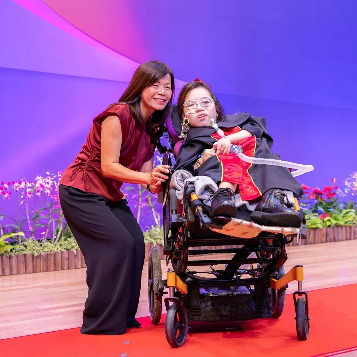 Ms Gwyn Lim Qi Zheng (right) was one of the recipients of TP's Ngee Ann Kongsi Most Outstanding Overcomer Award on May 8.