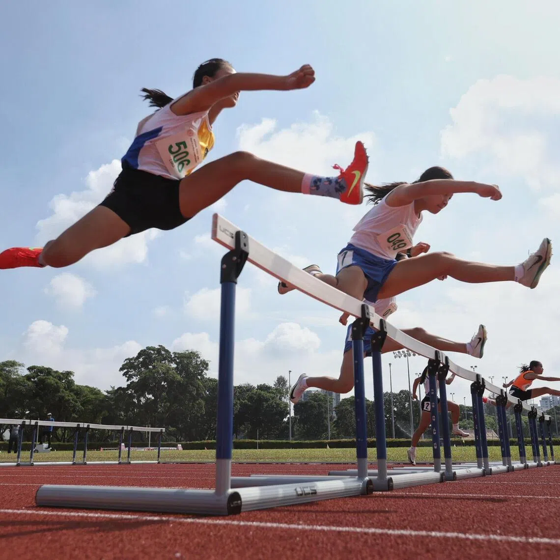 Girls competiting in the National School Games C division 80m hurdles held at the Kallang Practice Track on April 8.