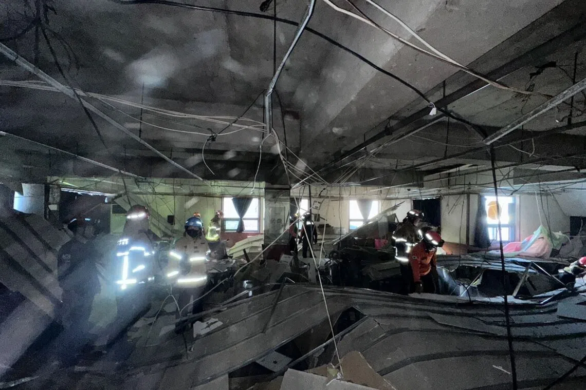 The collapse occurred on the second floor of the four-story building.