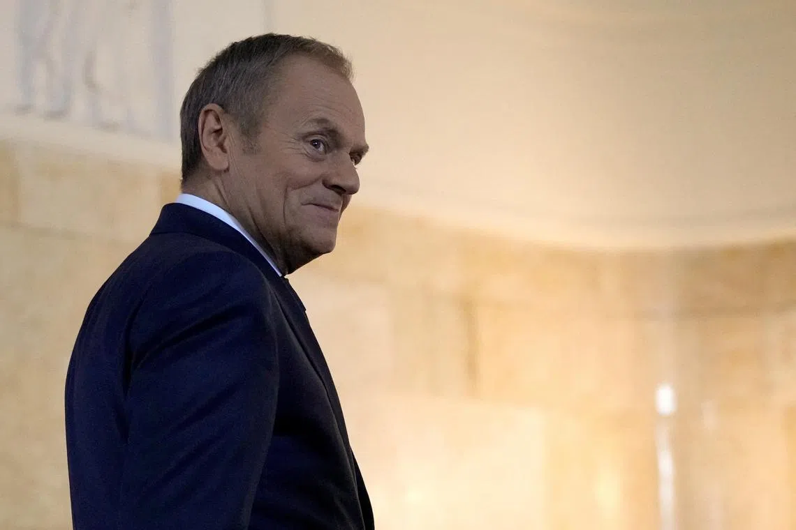 FILE PHOTO: Polish Prime Minister Donald Tusk walks to meet British Prime Minister Rishi Sunak at the Chancellery of the Prime Minister in Warsaw, Poland, April, 23, 2024. REUTERS/Aleksandra Szmigiel/File Photo