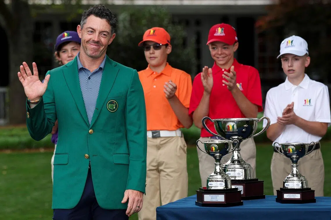 Masters champion Rory McIlroy poses with young golfers during the Drive, Chip and Putt Championship at Augusta National Golf Club on April 5. 