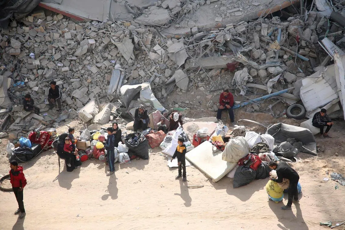 Palestinians inspect the damage in the area around Gaza's Al-Shifa hospital after the Israeli military withdrew on April 1, 2024, amid the ongoing battles Israel and the Hamas militant group. (Photo by AFP)