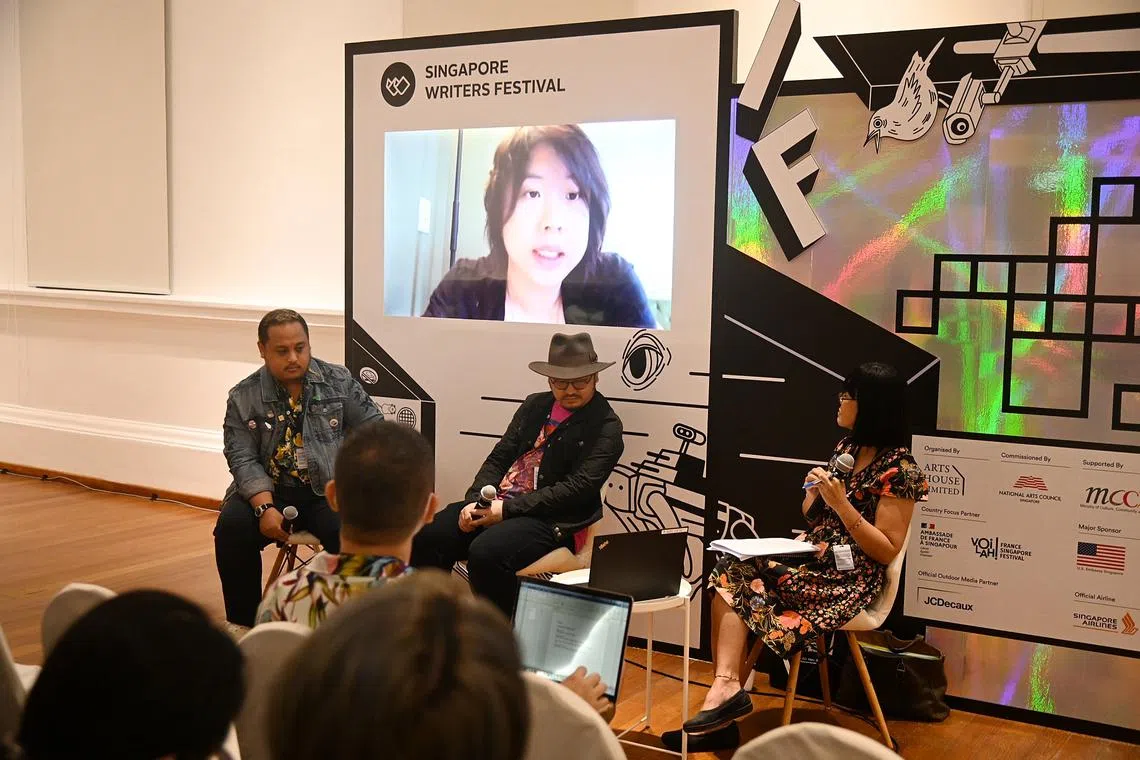 A Southeast Asian Cyberpunk Dream. 
From left : Mark Fillon ; Ario Anindito and Michelle Tanmizi ( moderator) 
Cassandra Khaw is pictured here on the screen online Zoom . 
Photo was taken on 4 Nov 2022 at Living Room at The Art House . 
Launch of the Singapore Writers Festival.