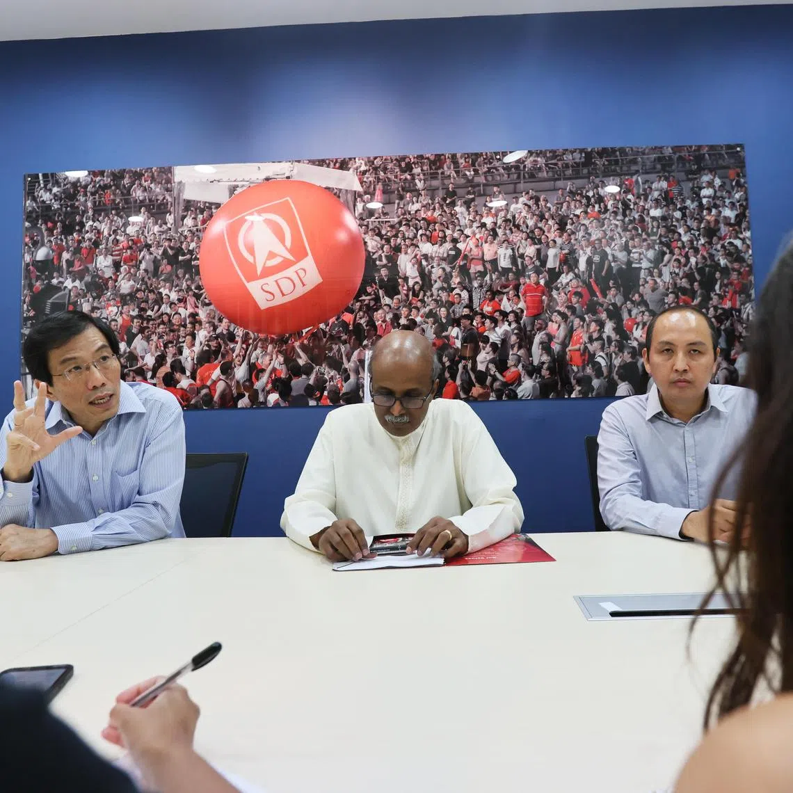(From left) SDP secretary-general Chee Soon Juan, chairman Paul Tambyah and vice-chairman Bryan Lim speaking at the opening of the new party headquarters on Nov 11. 