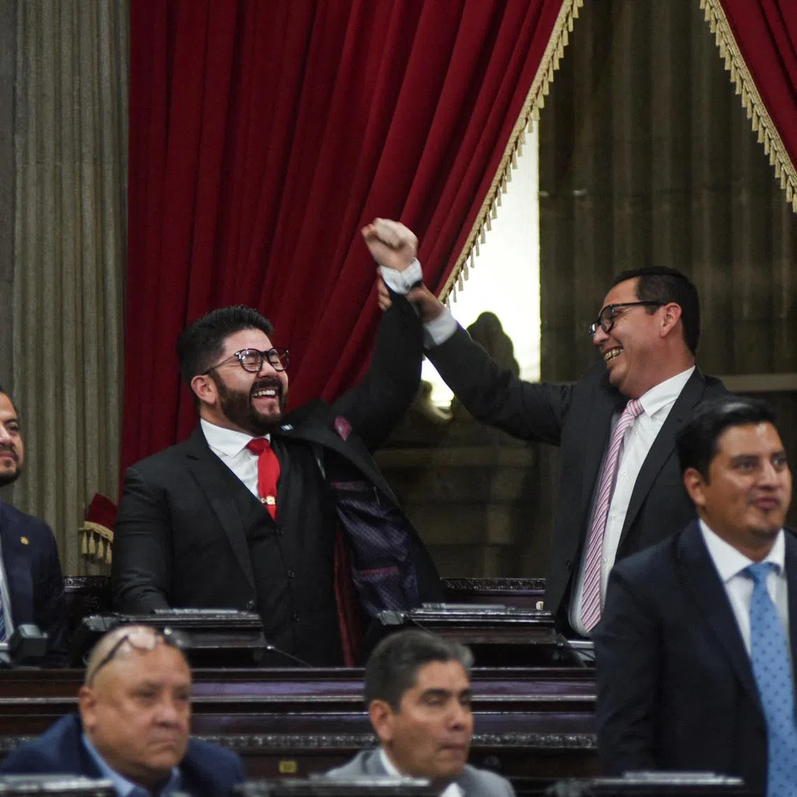 Lawmakers react during a session to elect new judges for the electoral court, as part of a process to renew senior officials in the judicial system that has drawn criticism from organizations such as the United Nations, which warn of the risk of it being co-opted by powerful groups, in the Guatemalan Congress, in Guatemala City, Guatemala, on March 10, 2026. REUTERS/Cristina Chiquin