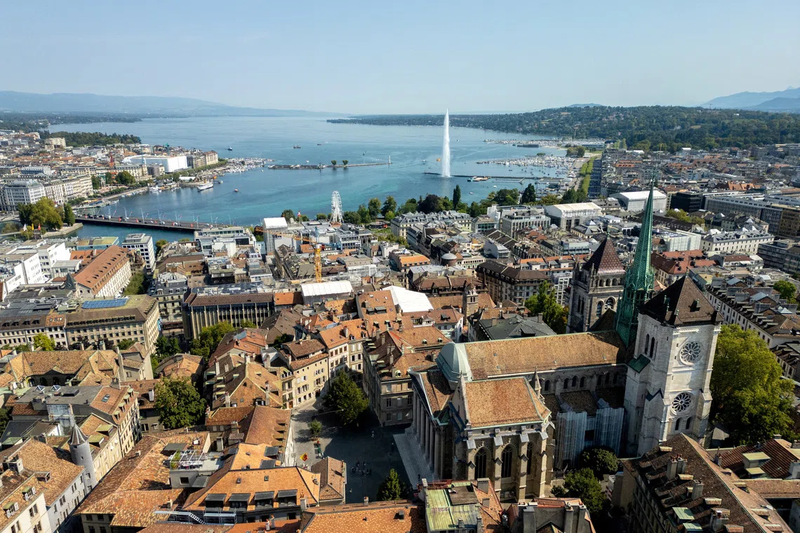 FILE PHOTO: A drone view shows the St. Pierre Cathedral and Lake Leman in Geneva, Switzerland, August 26, 2025. REUTERS/Denis Balibouse/File Photo