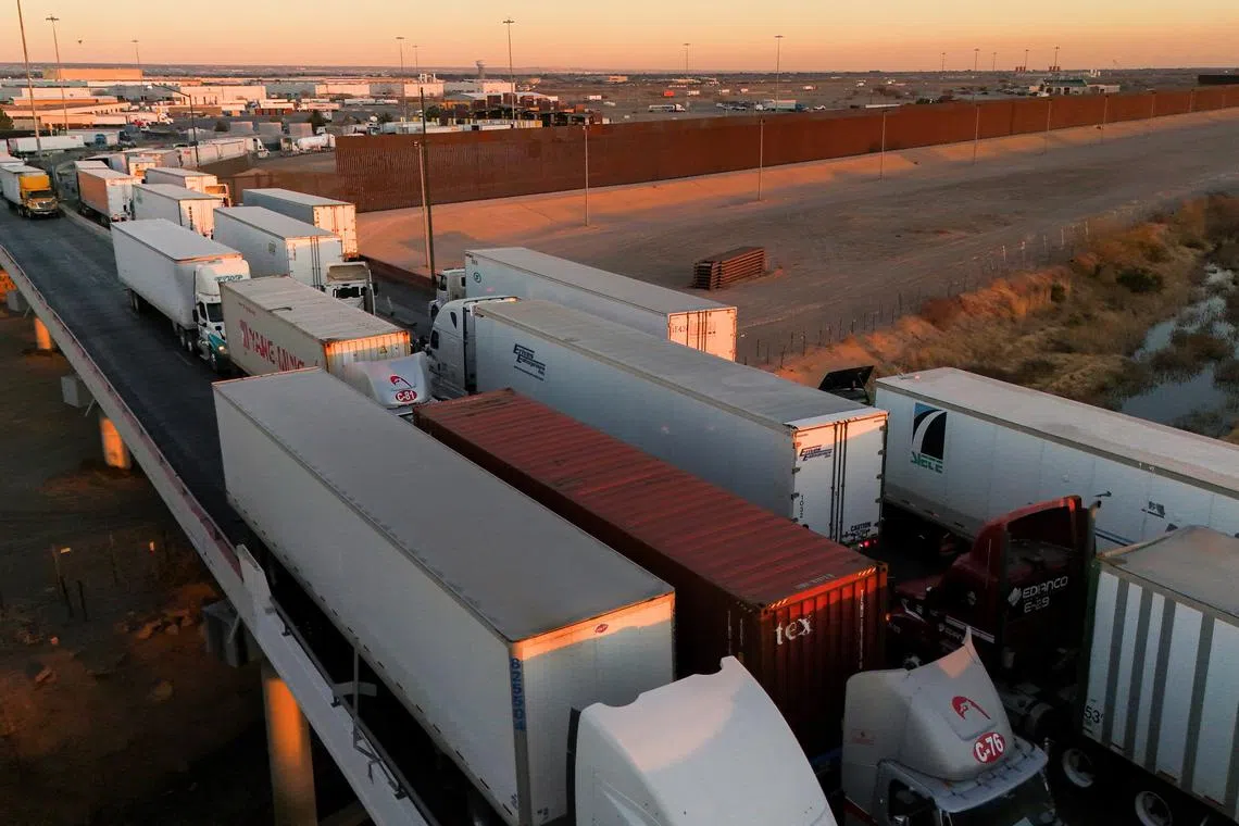 A drone view shows trucks waiting in line at the Zaragoza-Ysleta border bridge to cross the border between Mexico and the United States, in Ciudad Juarez, Mexico January 31, 2025. REUTERS/Jose Luis Gonzalez