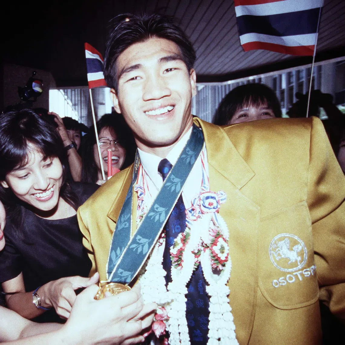 Somluck Kamsing upon his return from the 1996 Summer Olympics in Atlanta, where he won Thailand’s first gold medal in boxing.